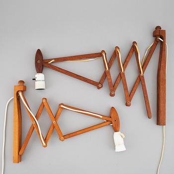 Two Le klint wooden wall lamps.