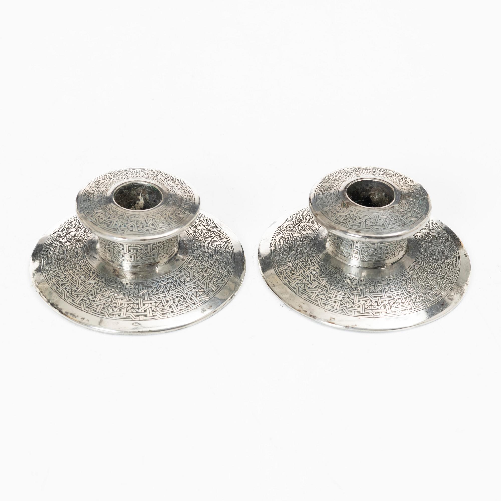 Two pairs of Persian silver candle holders, 20th century.