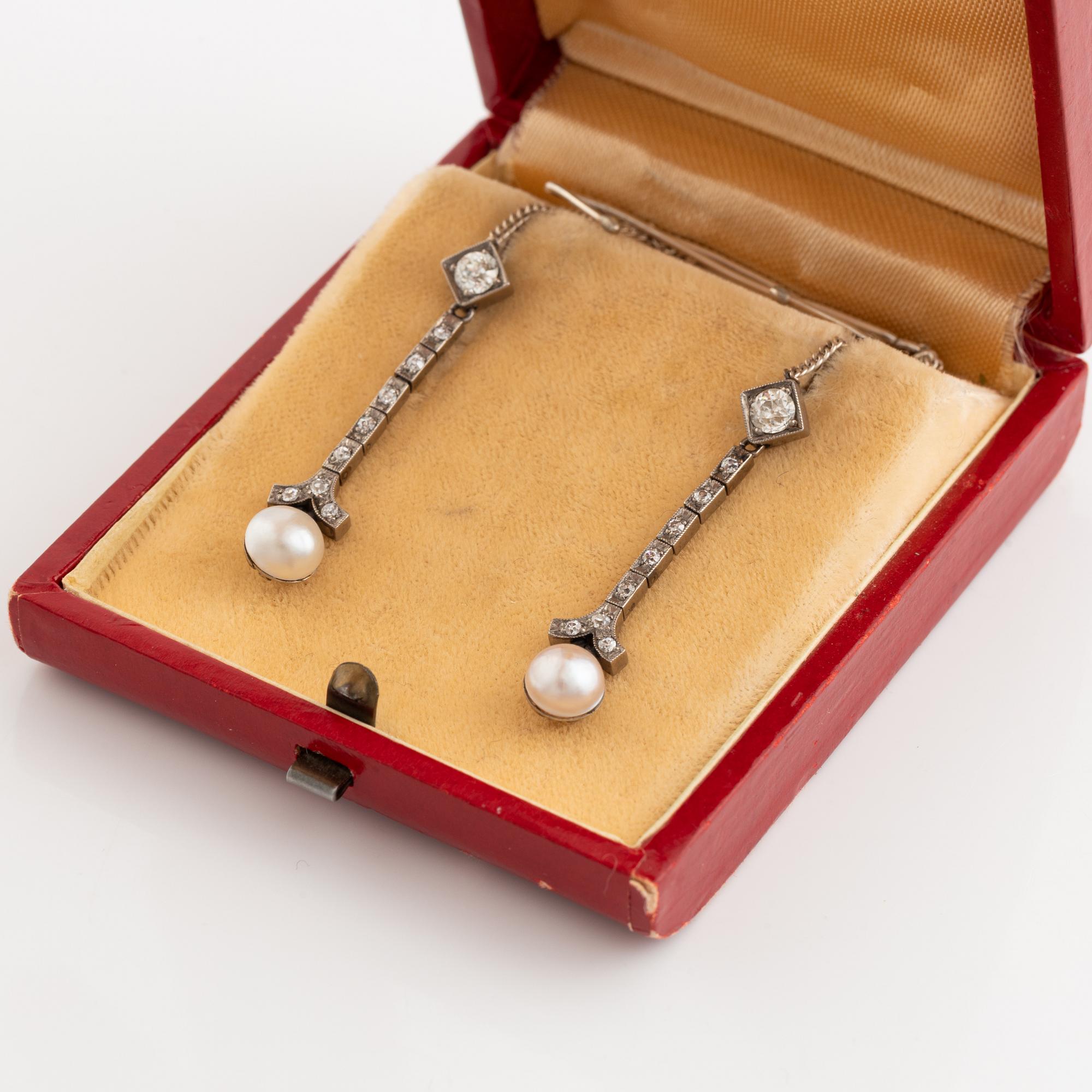 A pair of 18K gold and cultured halfpearl and diamond earrings.