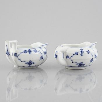 Two 'Musselmalet' porcelain creamers, Royal Copenhagen, one model 55, 19th century.