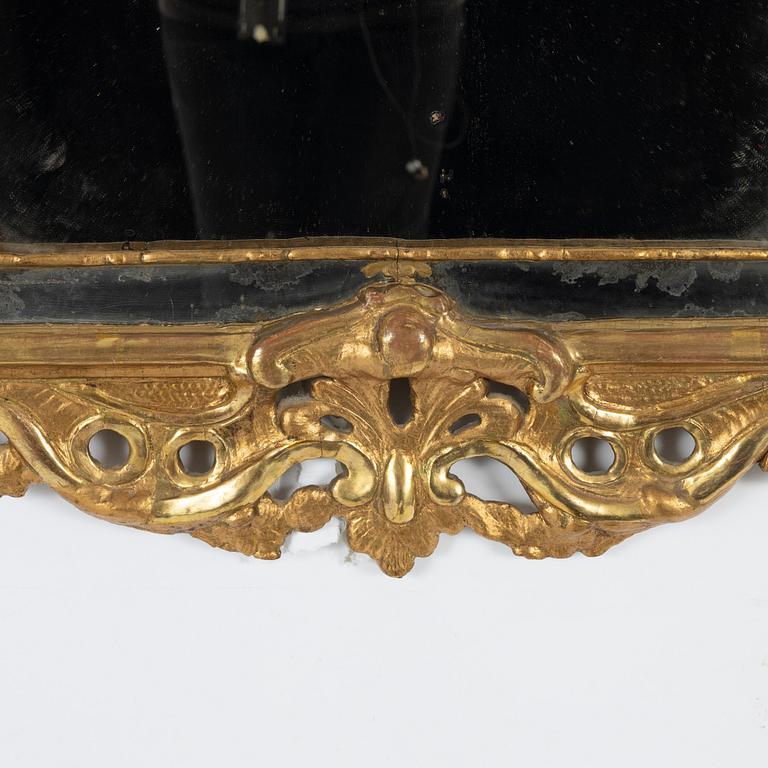 A Swedish giltwood rococo mirror, Stockholm, ltaer part 18th century.
