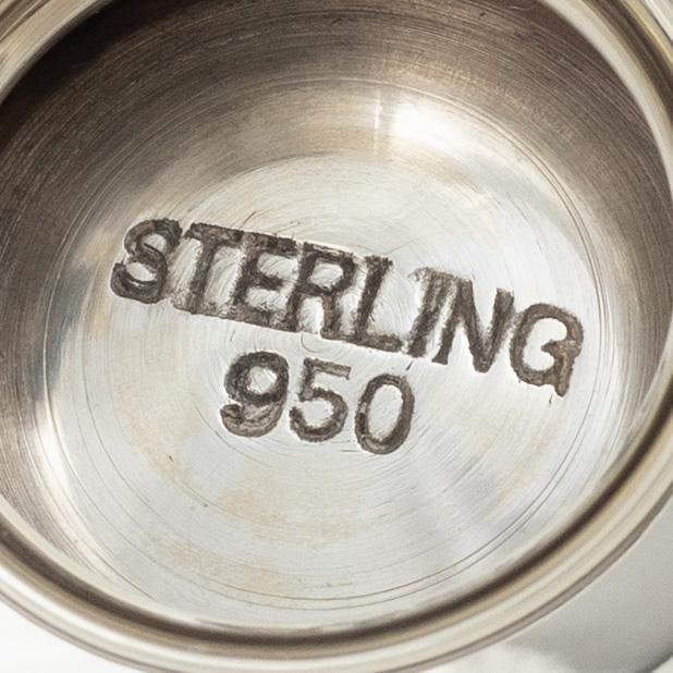 Two sterling silver tea strainers with stands, 20th century.