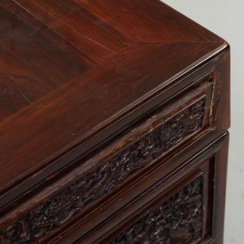 A carved hardwood desk, late Qing dynasty, circa 1900.