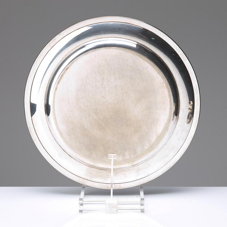 A set of four English silver salt-cellars and sauce-bowl and a dish plated metal.