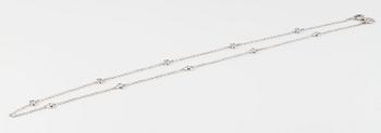 COLLIER, 18K vitguld med 10 briljantslipade diamanter ca 0.25 ct. Vikt 3,3 gram.