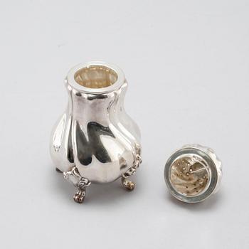 A silver sugar shaker, salt shaker and creamer, 19th-20th century.