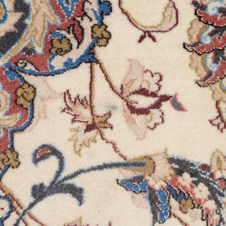 An Isfahan carpet, signed, approx. 372 x 255 cm.