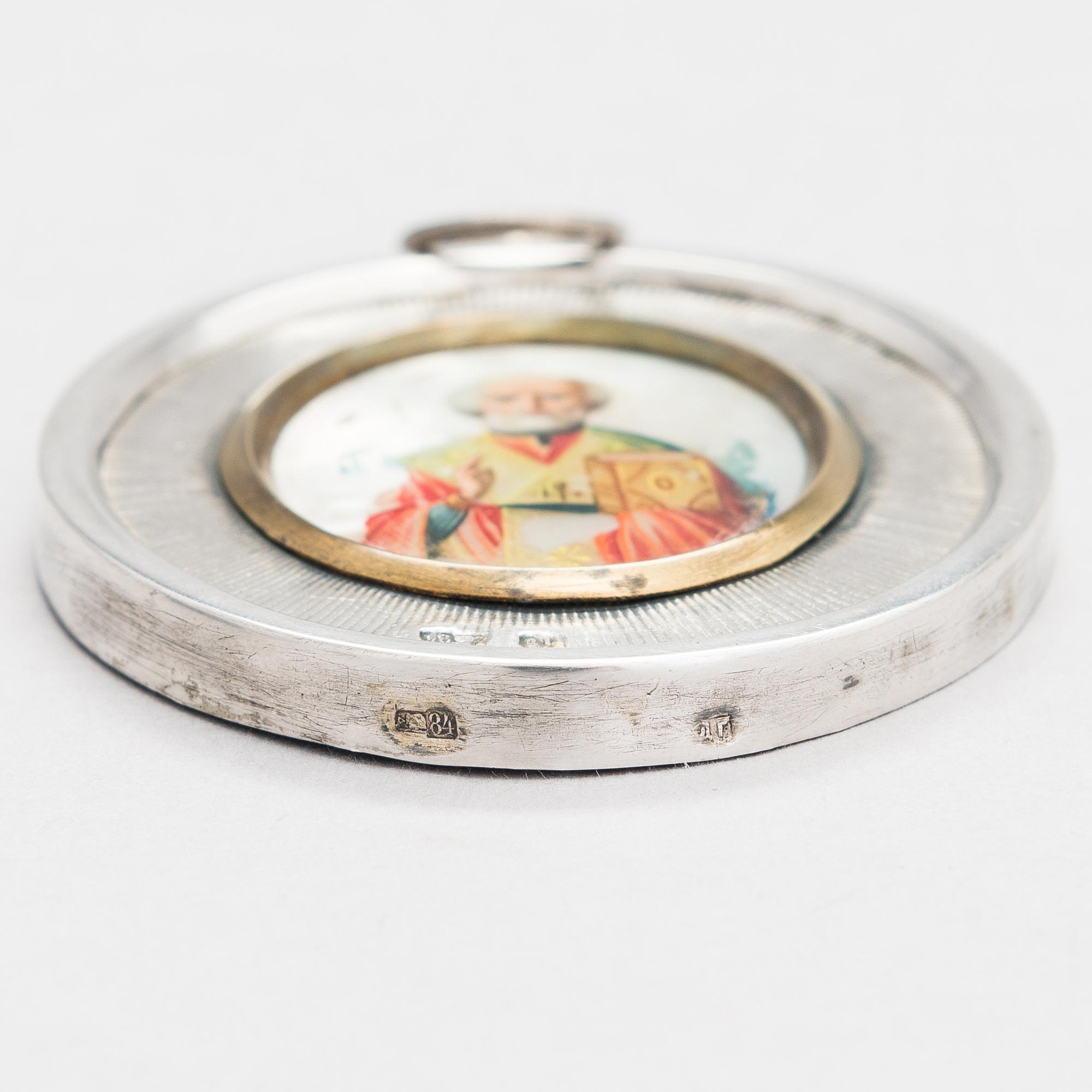 A silver and mother-of-pearl icon, Russian import mark, Moscow 1908-17.