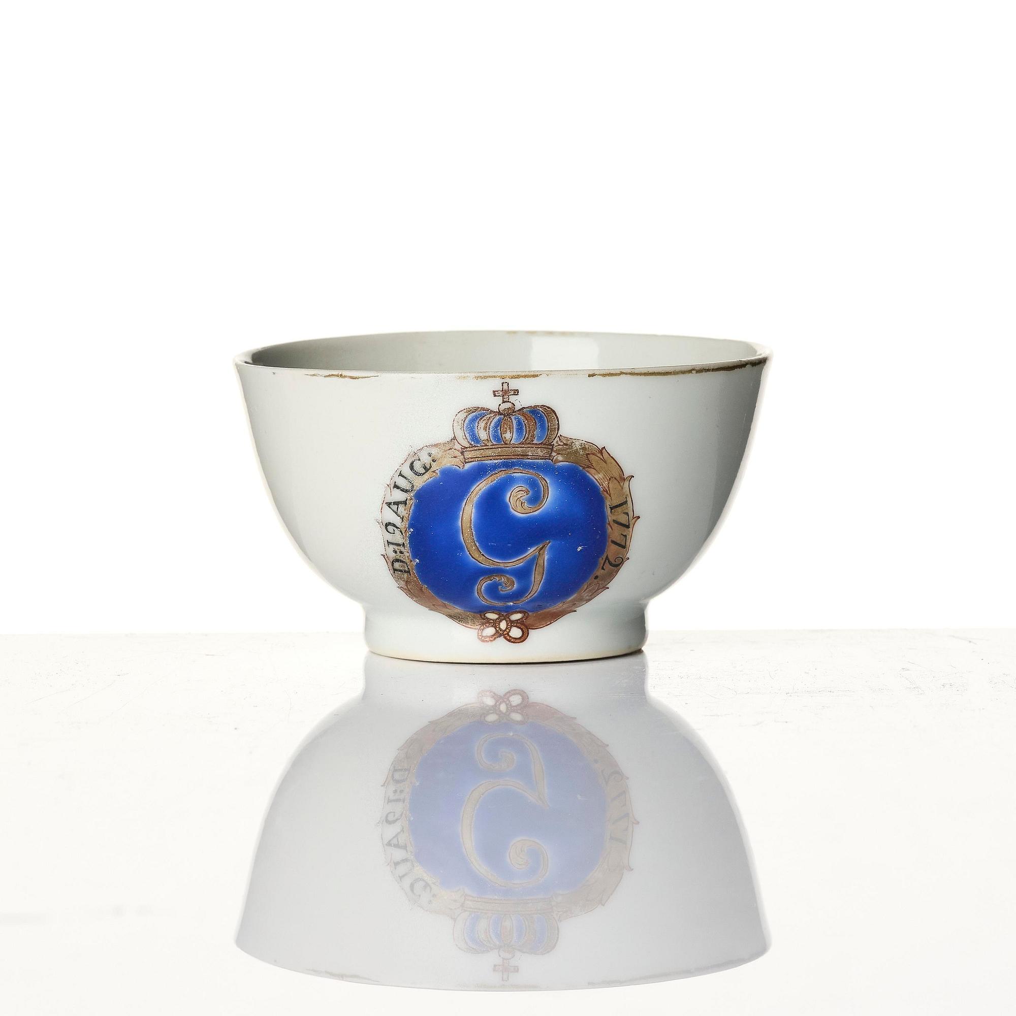 A famille rose armorial cup and stand with the monogram of the Swedish King Gustavus III, Qing dynasty, 18th century.
