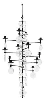 34. An Erik Höglund iron and cast glass chandelier for twelve candles, Boda Smide, Sweden.