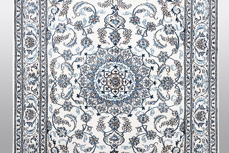 A carpet, Nain, 285 x 196 cm.