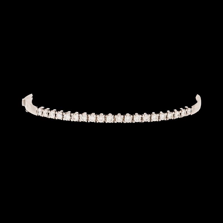 An 18K white gold bracelet set with round brilliant-cut diamonds.