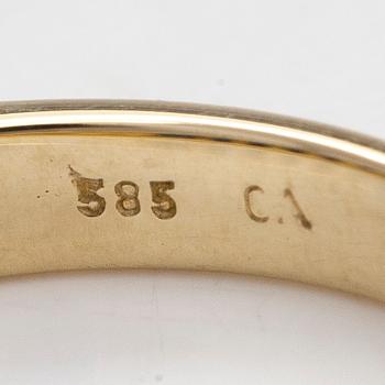 A half-eternity 14K gold ring with sapphires.