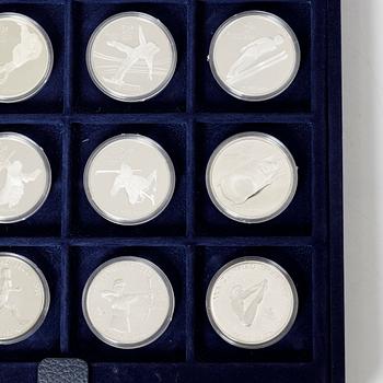 Twelve commemorative sterling silver coins, Olympic Games, Calgary and Seoul, 1988.