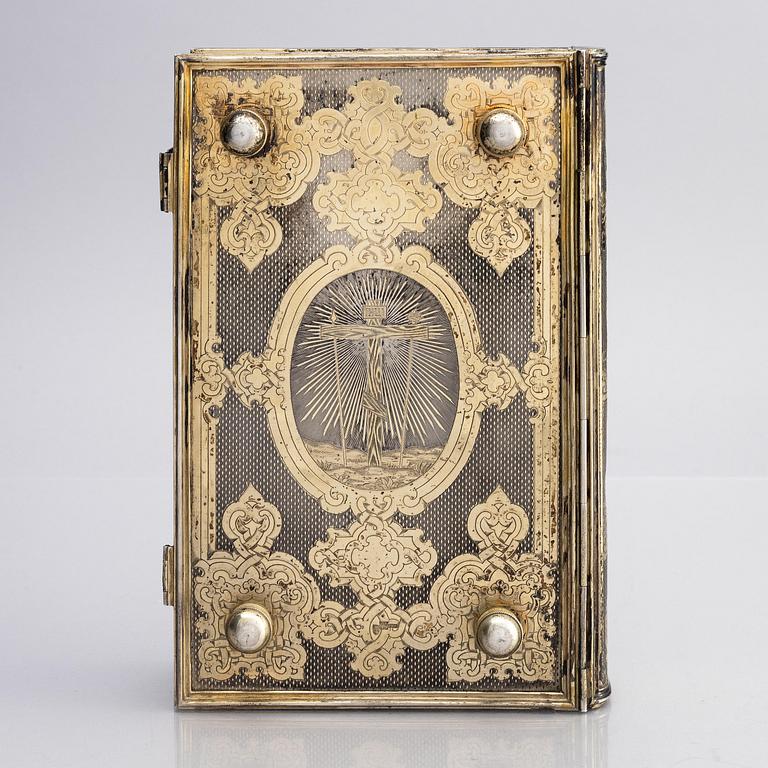 A Russian parcel-gilt silver book cover, mark of Sergei Vyerkovthyev, St. Petersburg 1873-1874.