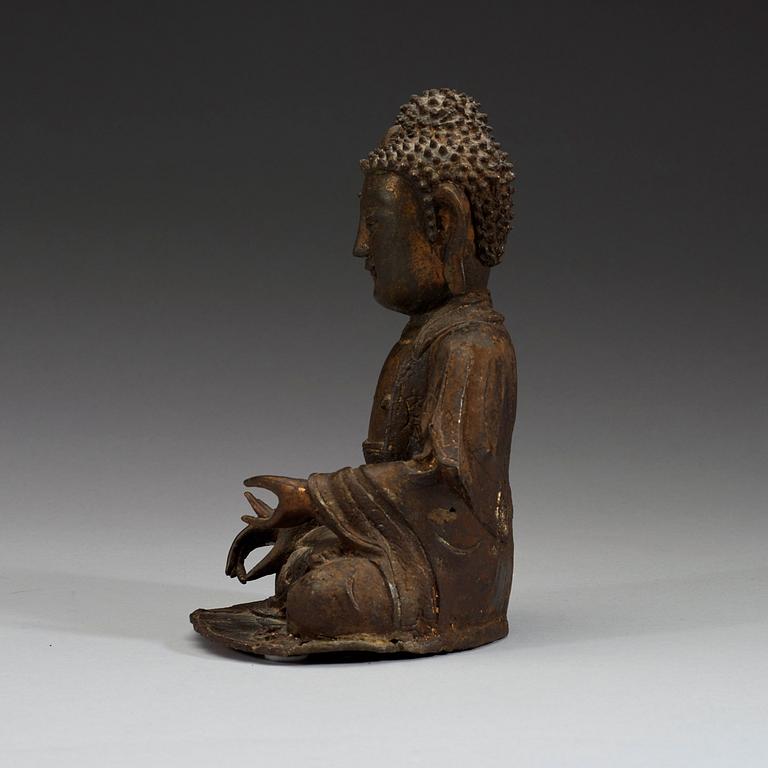 A bronze figure of a seated Buddha, late Ming dynasty (1368-1644).