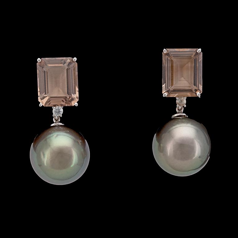 A pair of cultured Tahiti pearls, 14,8 mm, and smoky quartz earrings.