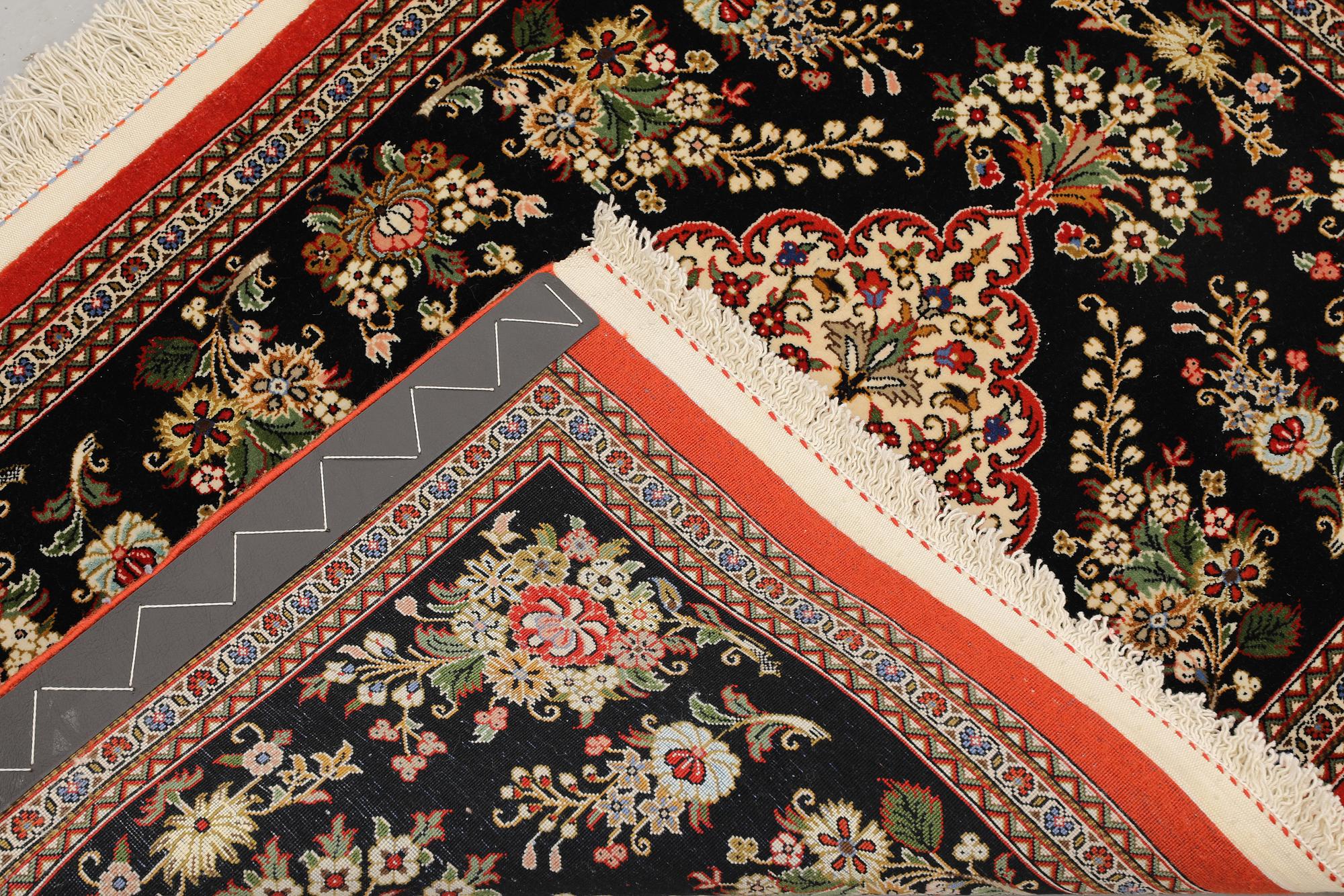 A pair of Tabriz rugs, part silk, so-called 50 Raj, 92 x 62 cm.