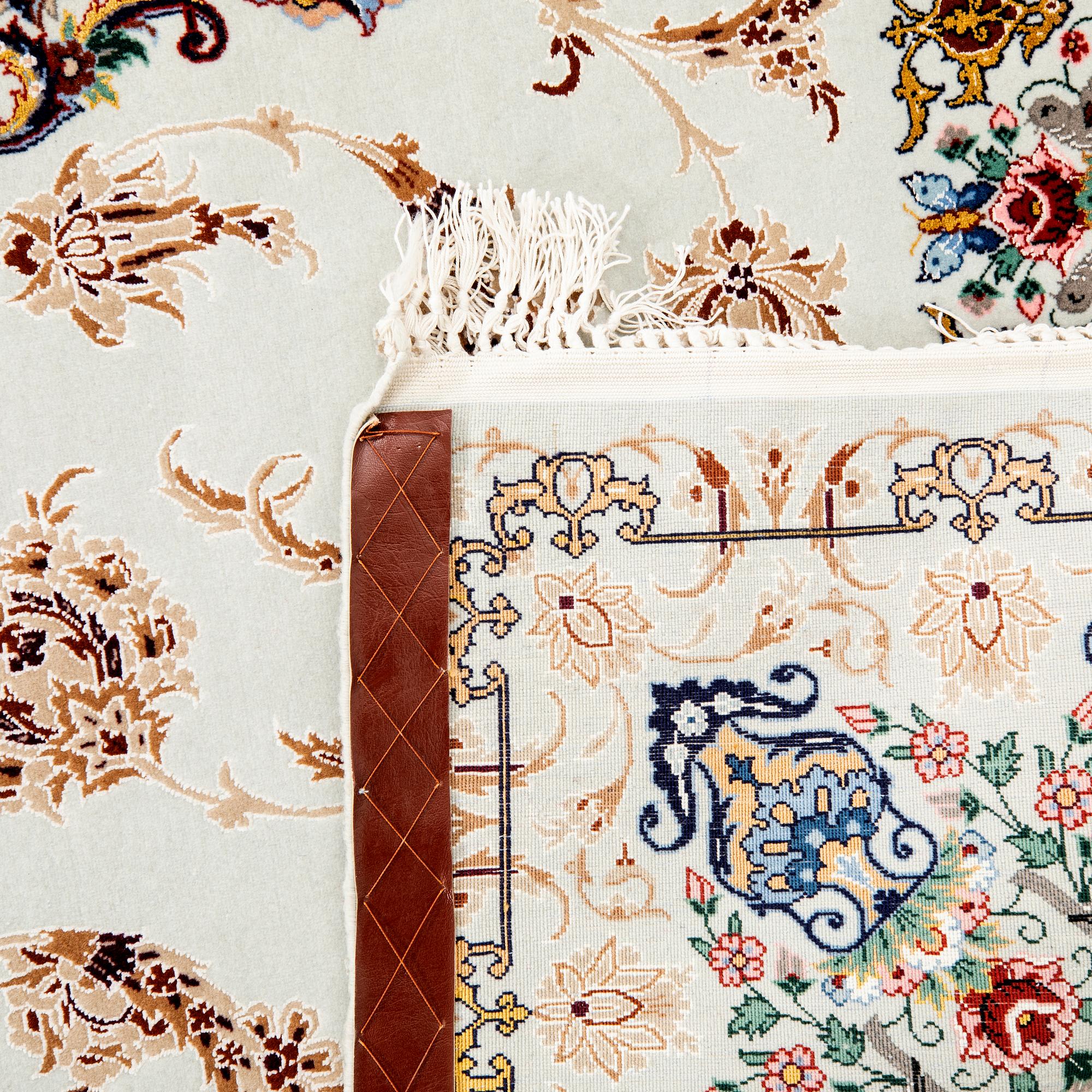 An old isfahan carpet part silk signed approx 222x148 cm.