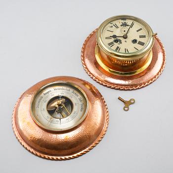 A 20th century ship clock and a barometer.