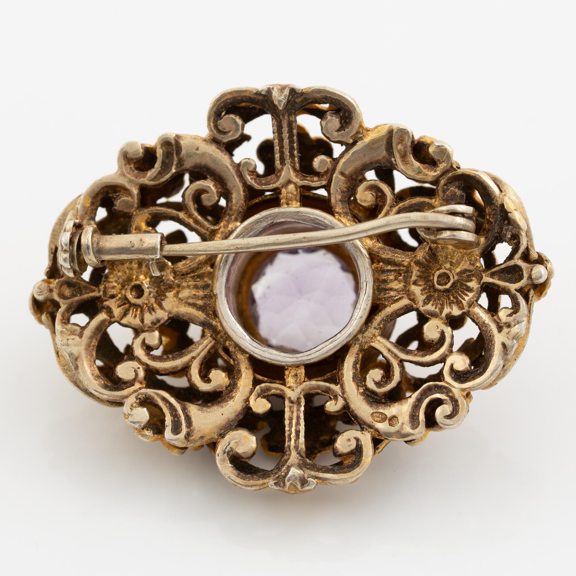 Brooch, gilded silver with amethyst and seed pearls.