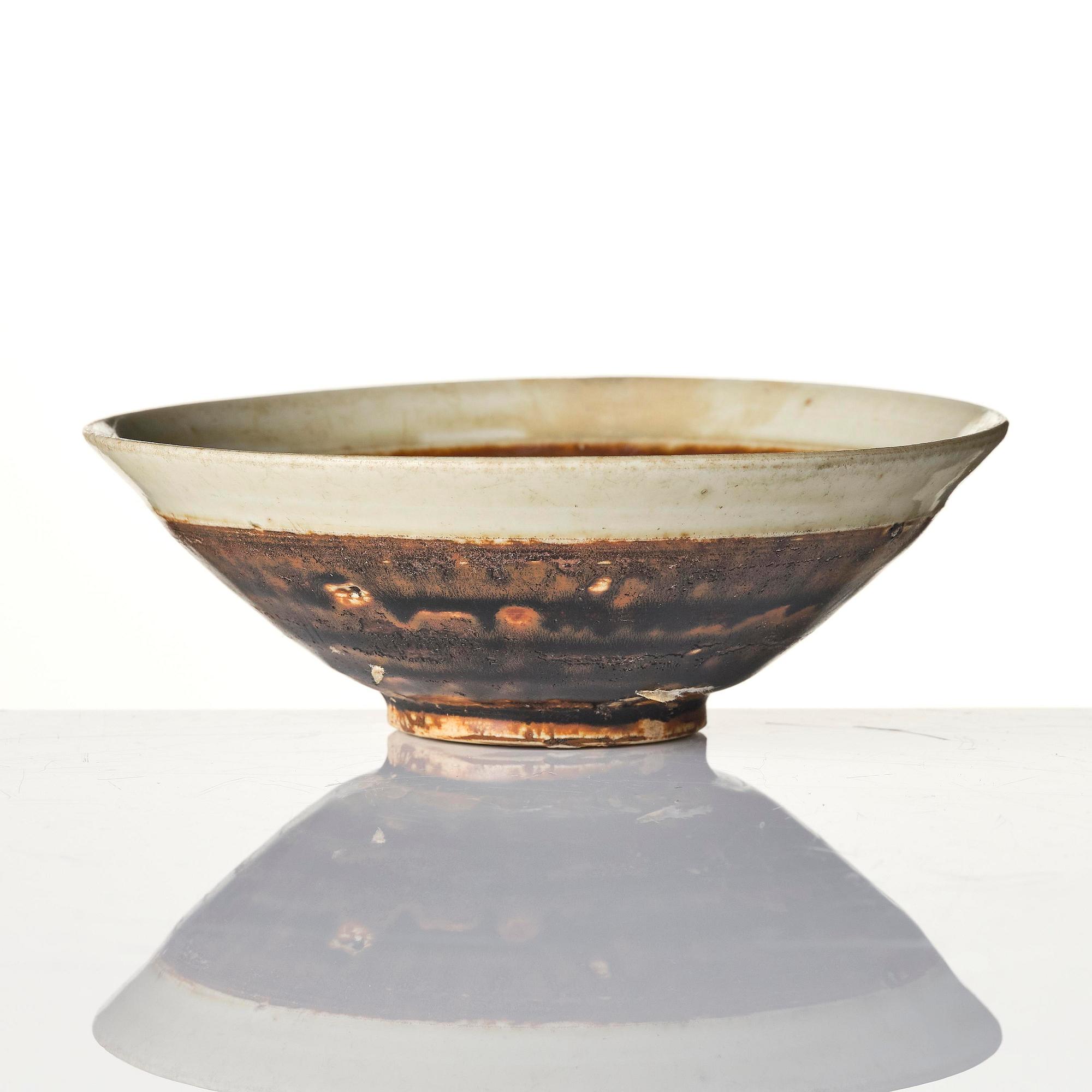 A brown and white glazed bowl, Song dynasty (960-1279).