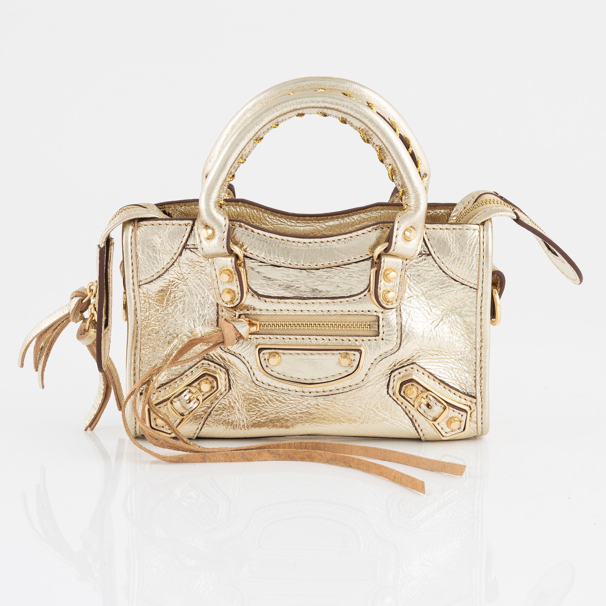 Balenciaga a gold leather Classic City Mini Bag Bukowskis