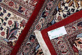 A part silk Ghom carpet, c. 346 x 251 cm.