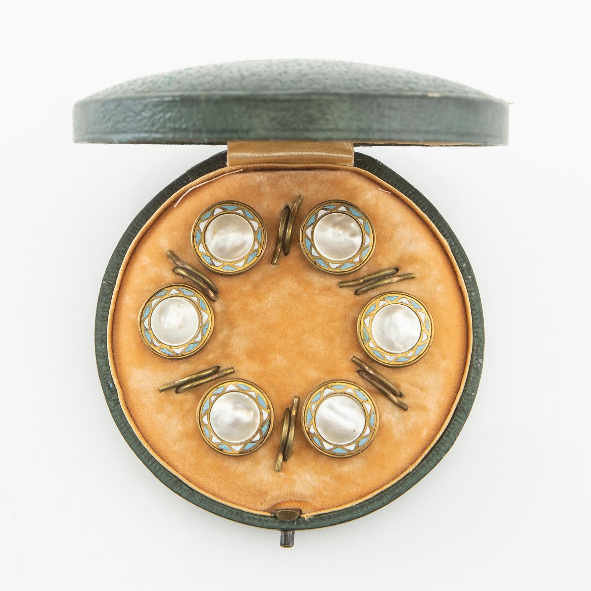 Shirt buttons made of brass with decoration of enamel and mother-of-pearl, early 20th century.