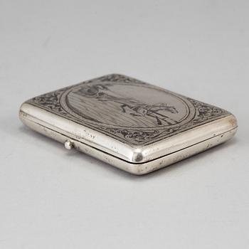A Russian parcel-gilt silver and niello cigarette-case, import marks 1882-98.