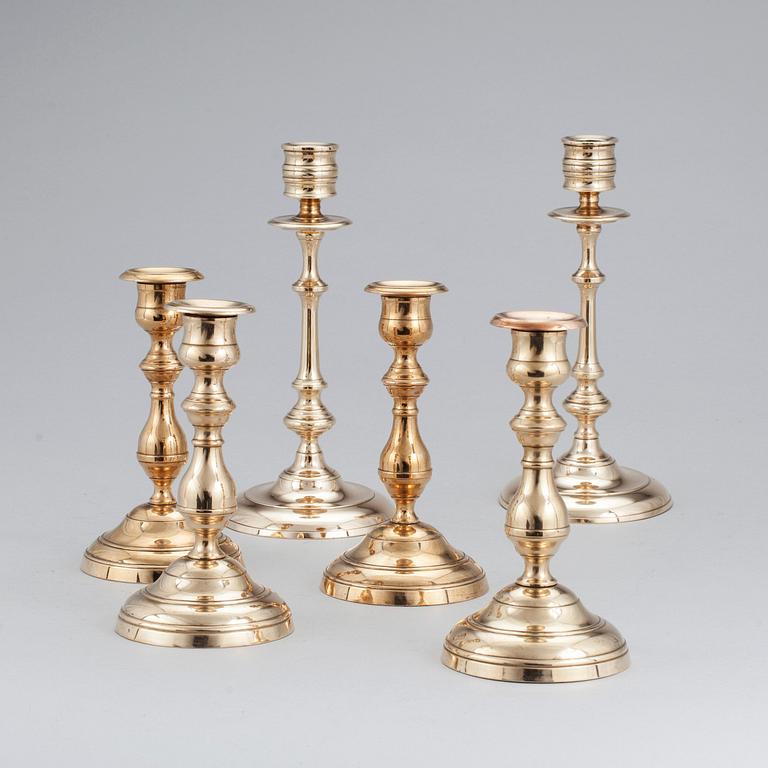 Three pair of candlesticks in brass, marked WMF, Westerås Metallfabrik and NLP. Late 19/early 20th century.