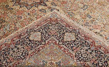 A 'Millefleur' Kerman Laver carpet, c. 398 x 300 cm.