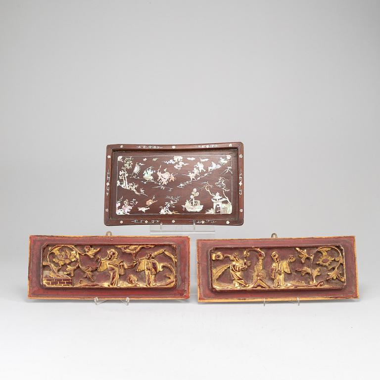 A wooden tray and two panels, Qing dynasty, 19th Century.