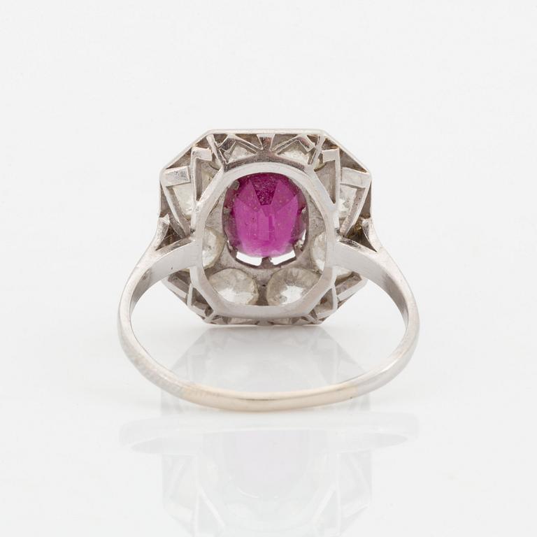 An 18K white gold ring set with a ruby and old-cut diamonds.