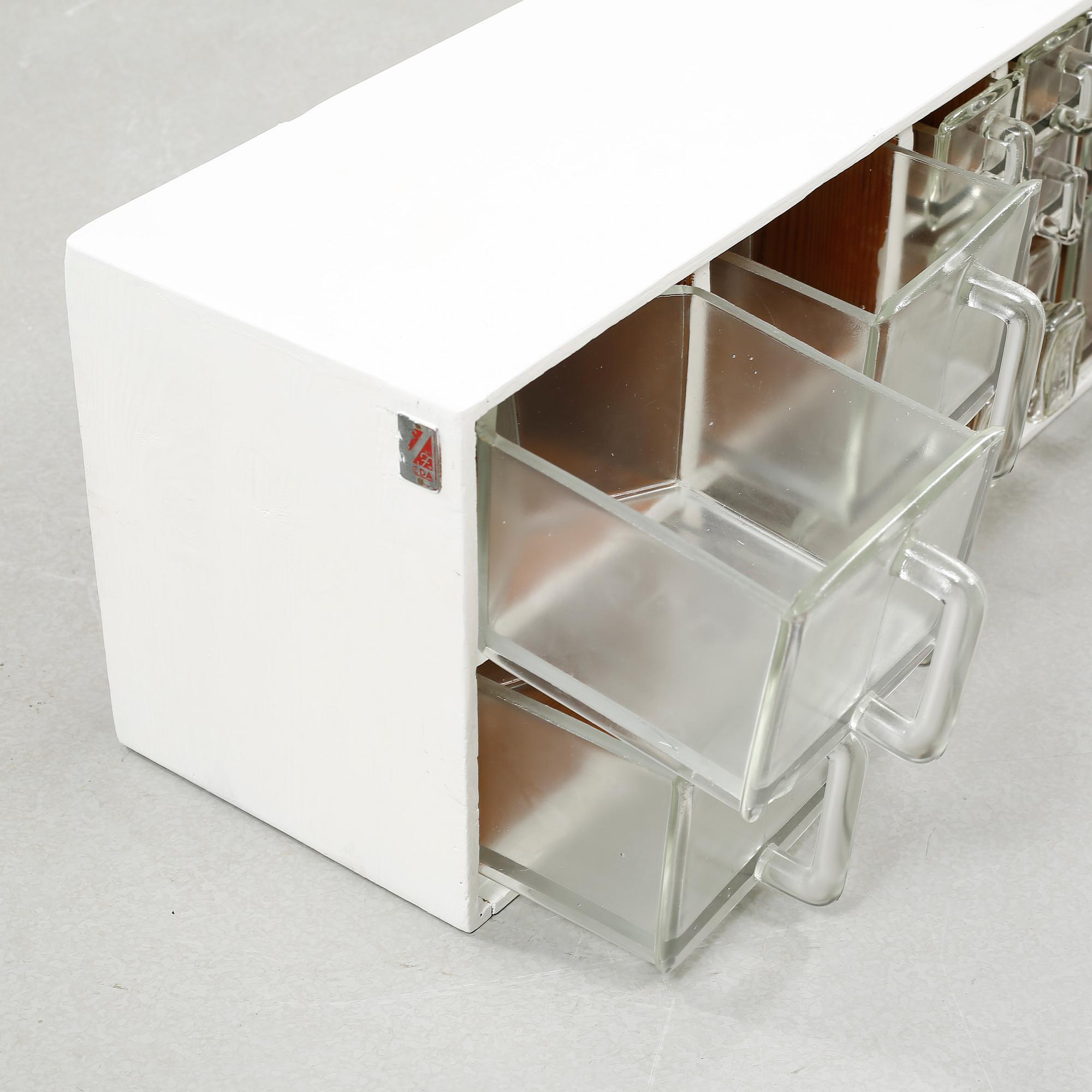 A spice rack from around the middle of the 20th century.