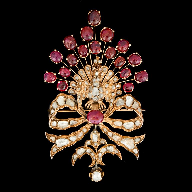 A cabochon ruby and rose cut diamond brooch, designed as a peacock.