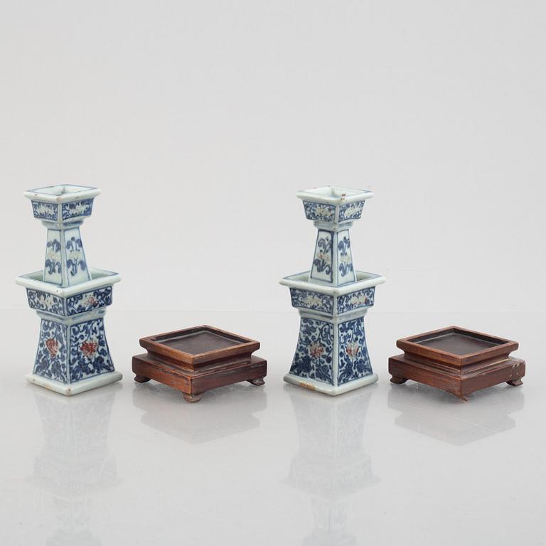 A pair of Chinese porcelain altar sticks, late Qing dynasty.