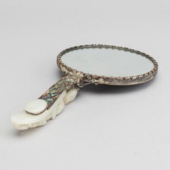 A Chinese silver mirror with carved nephrite placque and belt hook, early 20th Century.