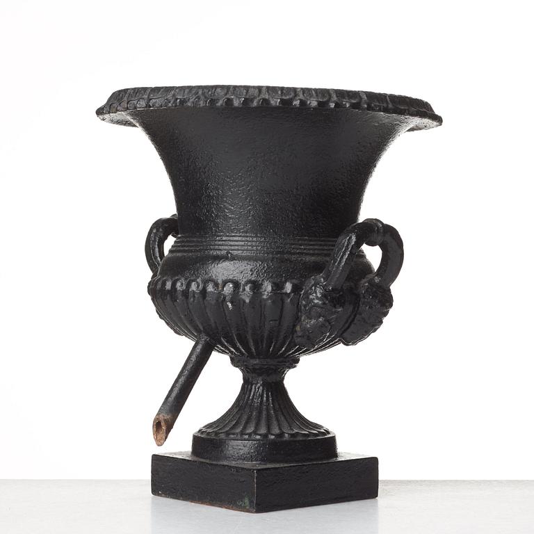 A Louis XVI-style garden urn, circa 1900.