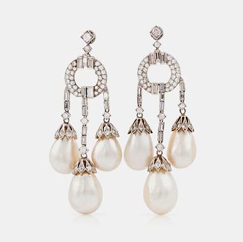 A pair of natural drop-shaped saltwater pearl and diamond Girandole earrings.