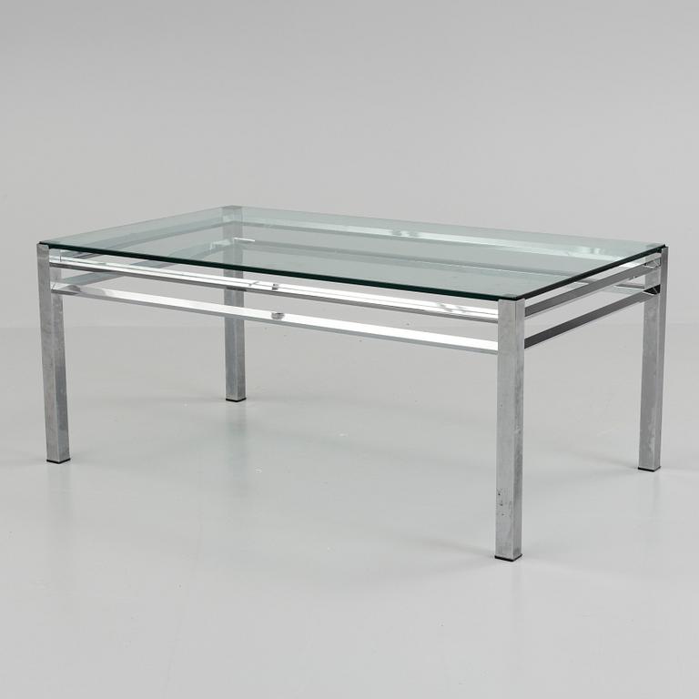 A 1980´s metal table with glass top.