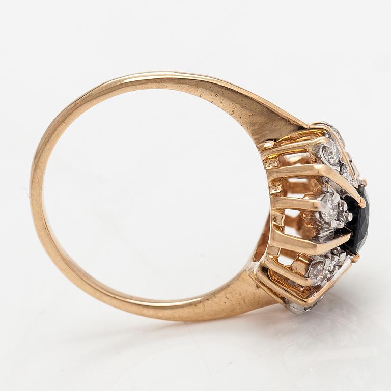 A 14K gold ring with diamonds ca. 0.40 ct in total and a sapphire. Finland 1995.