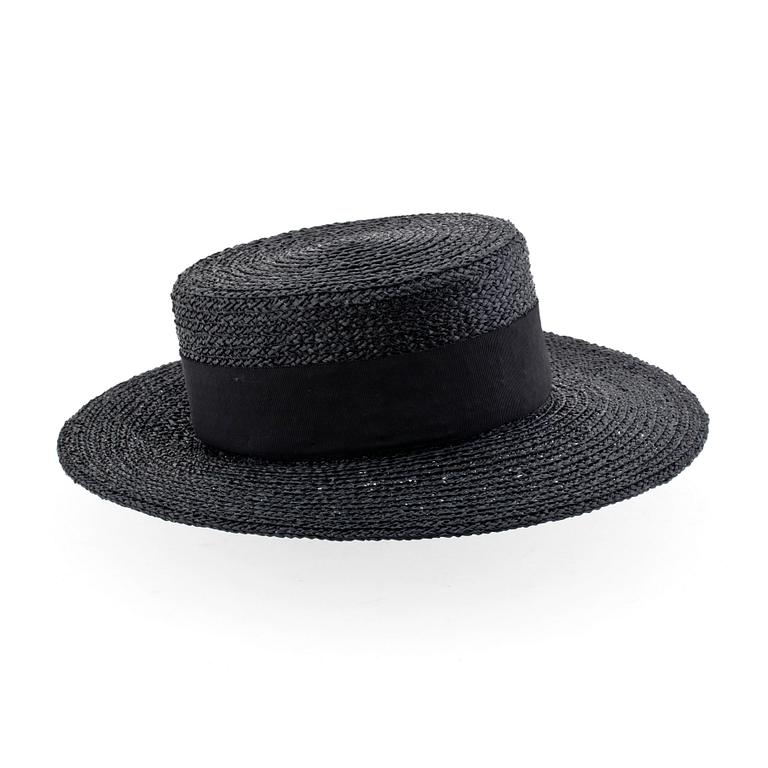 CHANEL, a black straw hat.