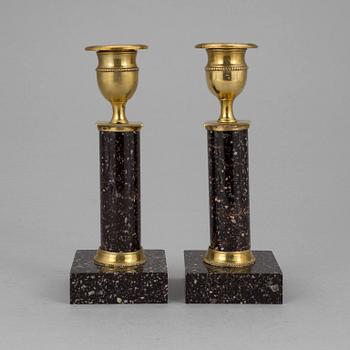 A pair of late gustavian porphyry candle sticks early 19th century.