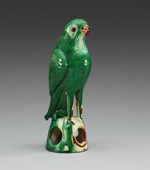 A green glazed figure of a falcon, Qing dynasty.