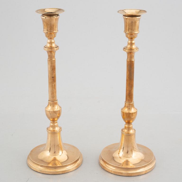 Two pairs of brass candlesticks, 19th century - early 20th century.