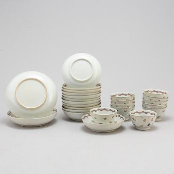 Eleven Chinese porcelian cups and saucers and two small dishes, circa 1800.