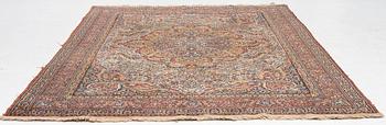 A semi-antique oriental carpet, c. 290 x 195 cm.