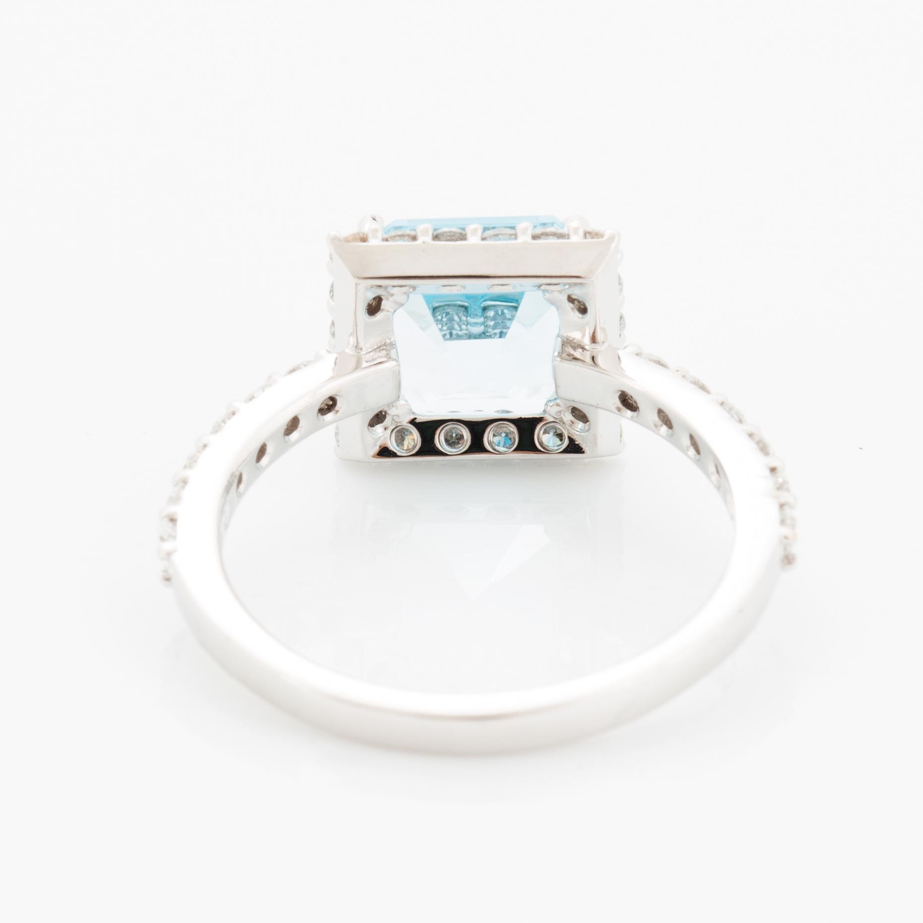 Blue topaz and brilliant-cut diamond ring.
