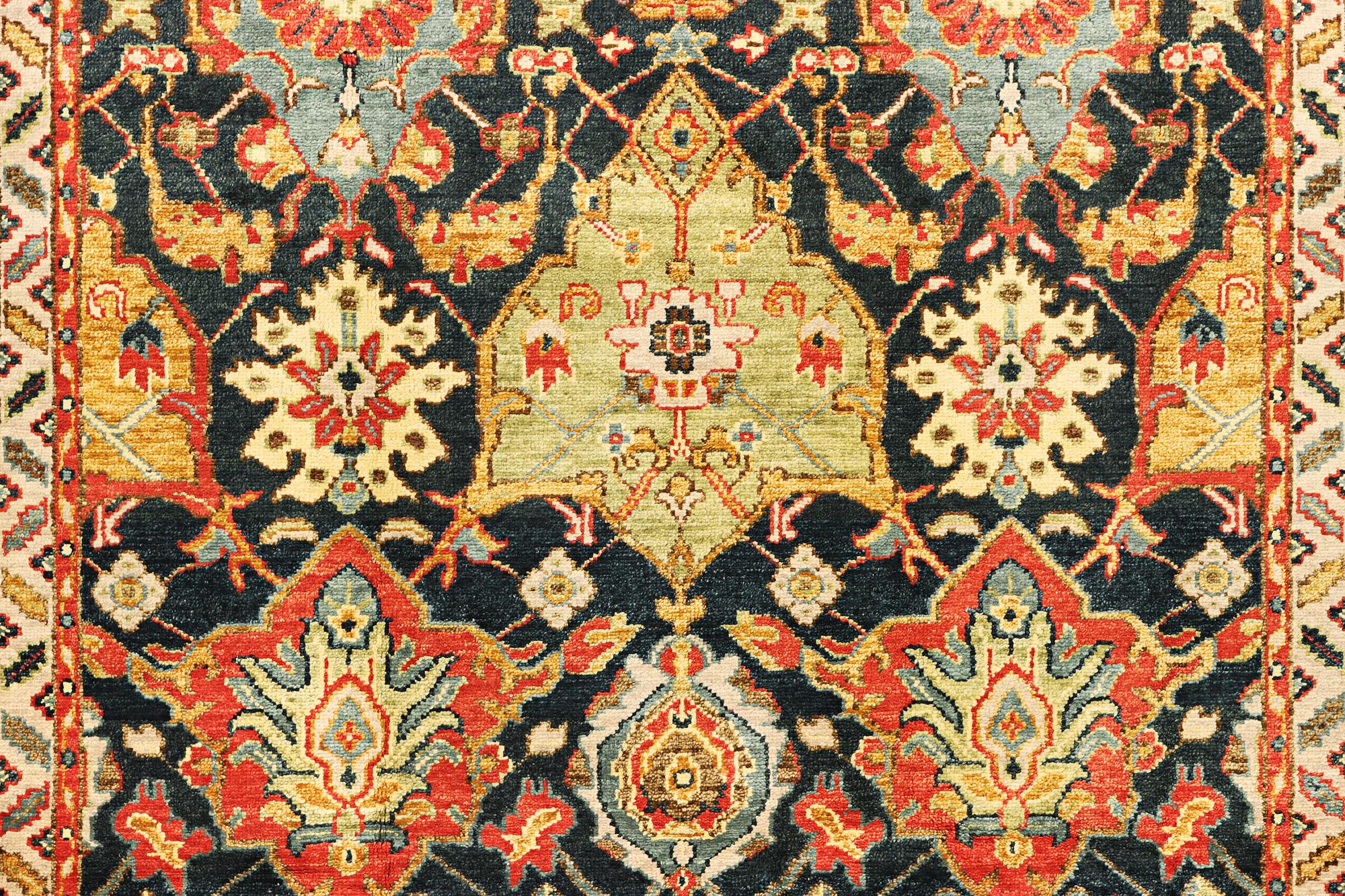 An oriental carpet with Mamluk design, a. 331 x 274 cm.